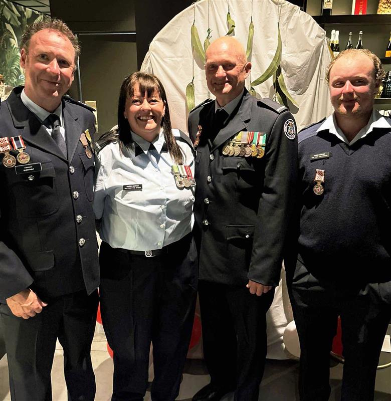Karen Barton (Firefighter of the year), Dwayne Barton (20 year service medal), Kane Barton (10 year service medal) receiving their awards